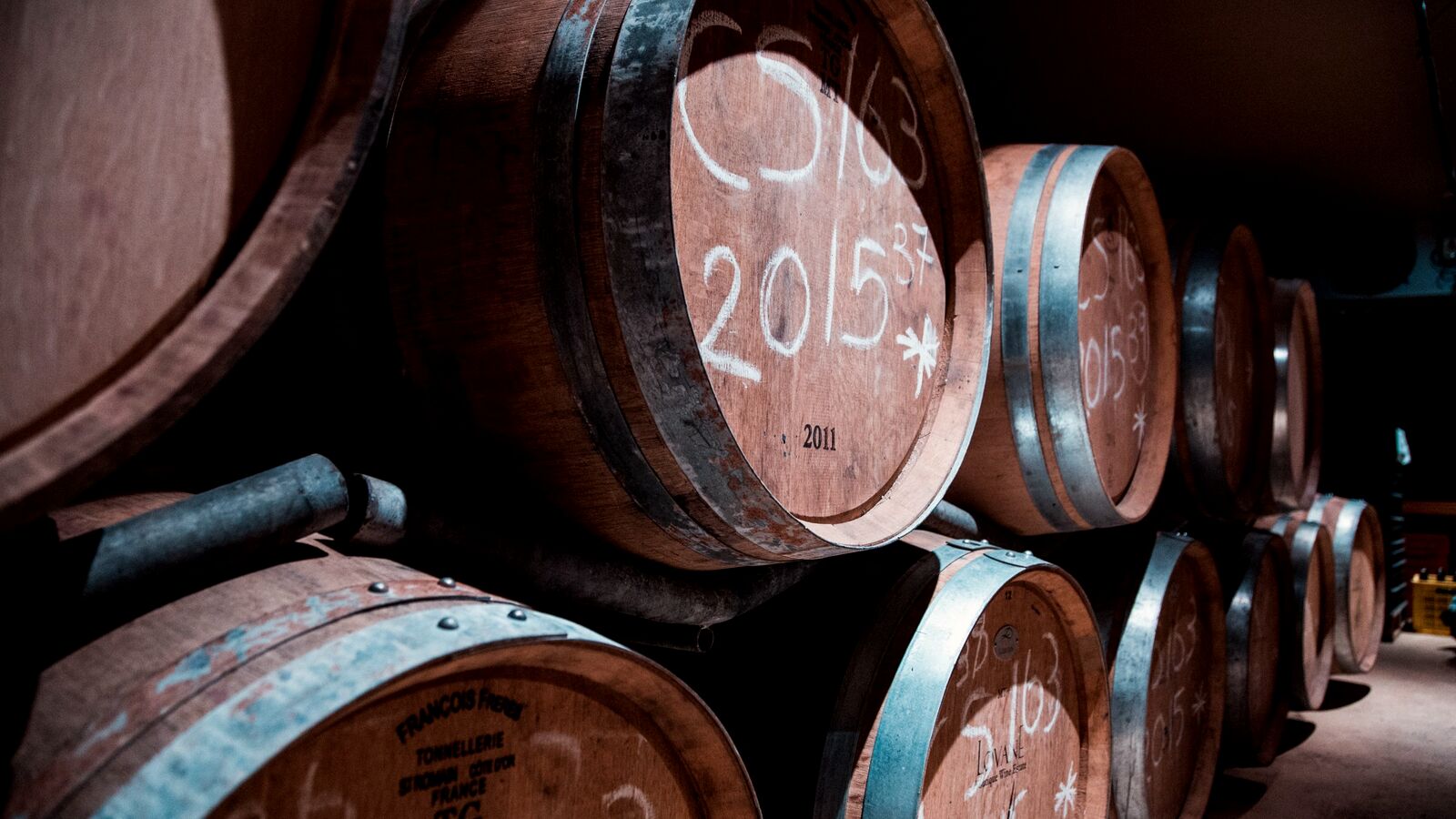 Old oak barrels in the quiet of a cellar